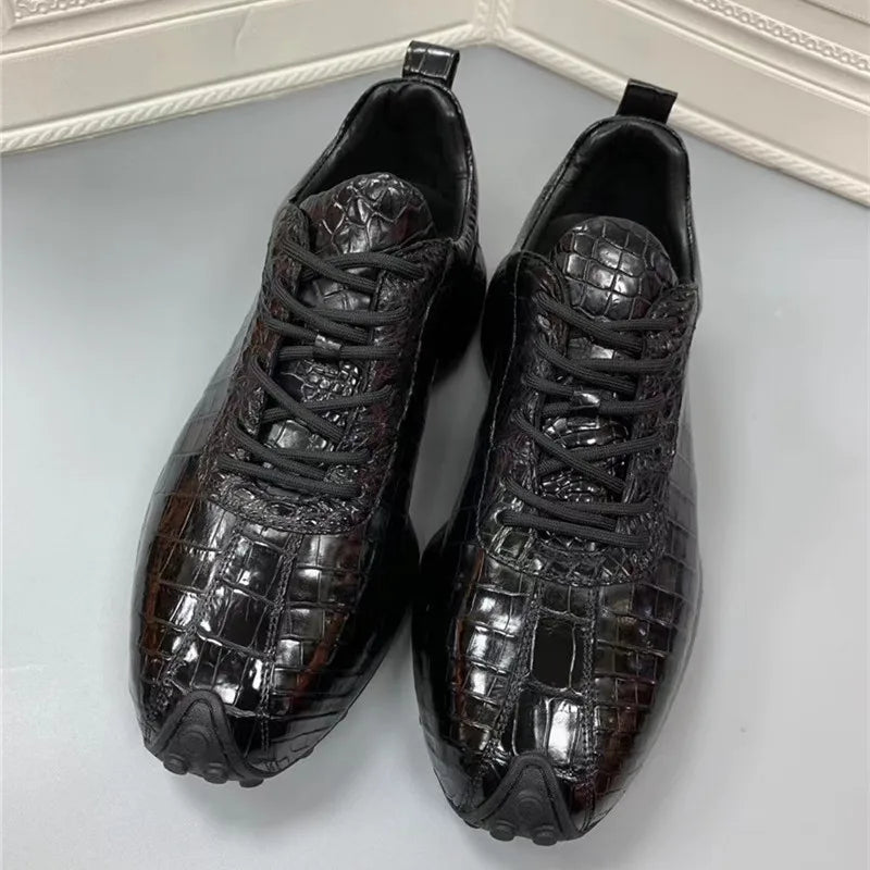 Front view of lace-up TREKHE sneaker with rounded toe and crocodile texture